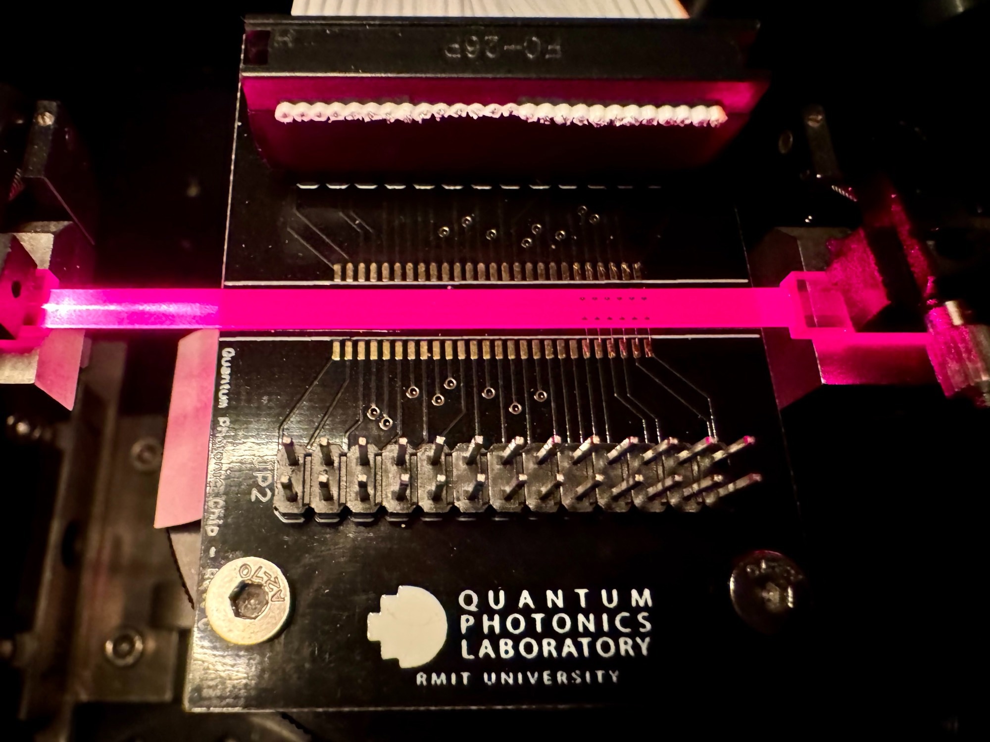The team’s reprogrammable light-based processor. Credit: Will Wright, RMIT University.  Programmable high-dimensional Hamiltonian in a photonic waveguide array