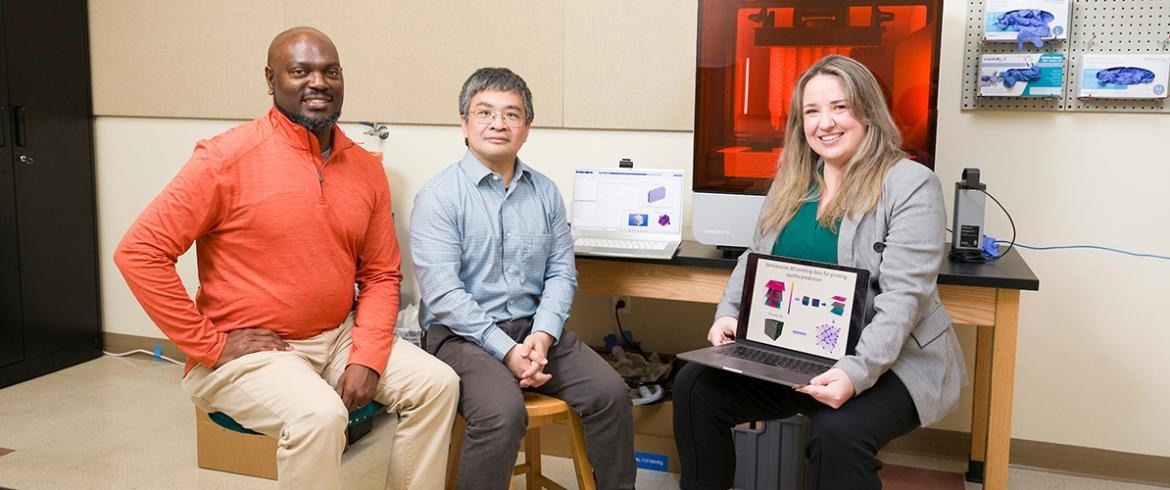 From left, Associate Professor Tarik Dickens, Associate Professor Hui Wang, and Assistant Professor Rebekah Downes pose in a lab in the High-Performance Materials Institute in the Materials Research Building at FAMU-FSU College of Engineering. The team, led by Wang, has been awarded over $2.2 million in funding from the Air Force Office of Scientific Research to use artificial intelligence technology to advance defect detection in powder-based additive manufacturing. (Scott Holstein/FAMU-FSU College of Engineering)