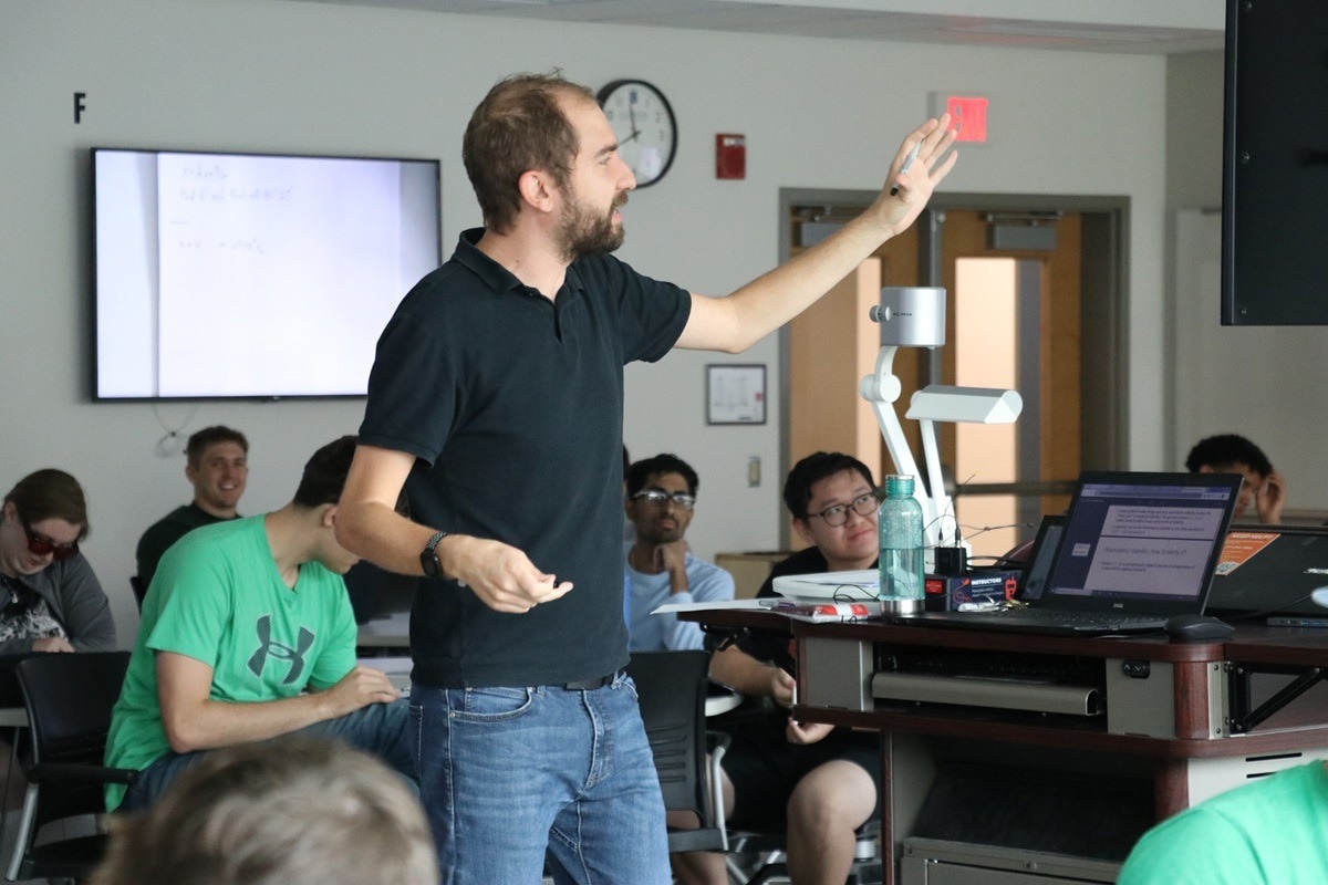 Melkior Ornik lecturing in AE 353: Aerospace Control Systems. Research: The Lazy Student