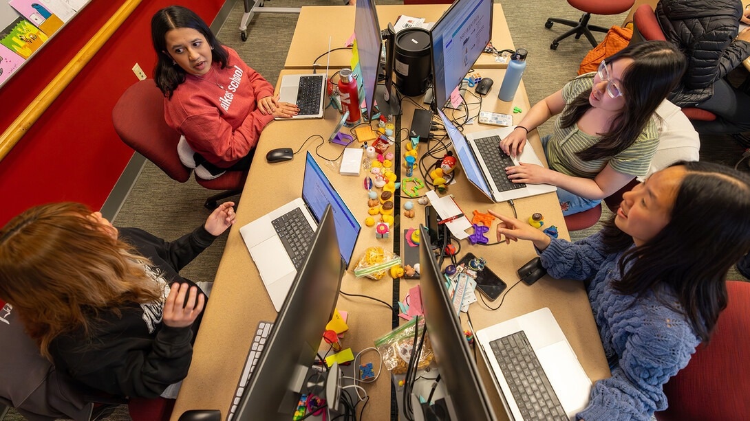 The Raikes School Design Studio team works on creating the AI program for Buckle, a Nebraska-based clothing retailer. The team includes (clockwise from top left) Radhika Damle, Victoria Chin, Ealynn Hsu and Katia Henrriquez.Image Credit: Aaron Nix | University Communication and Marketing